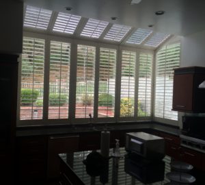 Motorized Silhouette Shades on a large angled kitchen window