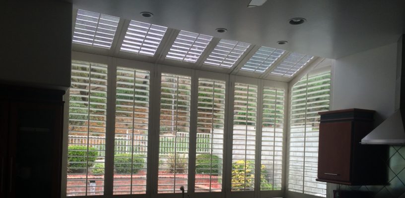 Motorized Silhouette Shades on a large angled kitchen window