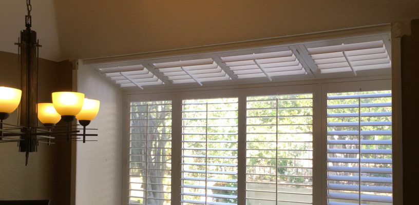 Wood Shutters covering a bay window